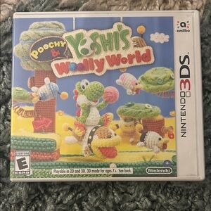 Nintendo 3DS Poochy & Yoshi's Woolly World - Blue, Green, Yellow Cover